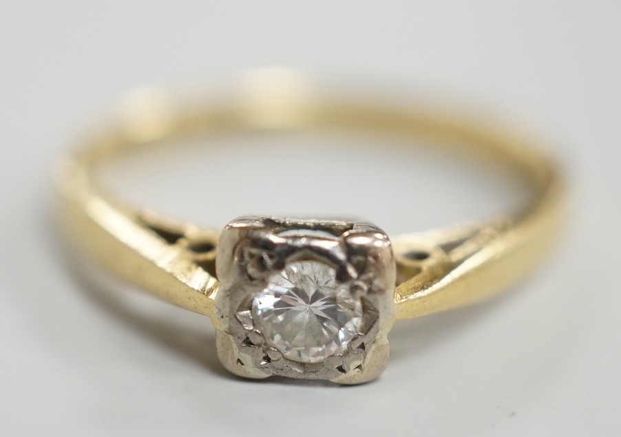 A modern 18ct gold and solitaire diamond ring, size K, gross weight 2.3 grams.